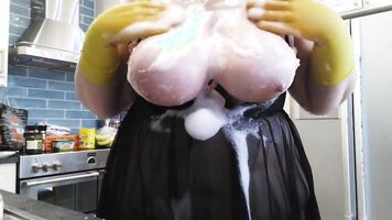 Wet bubbly tit play in rubber gloves